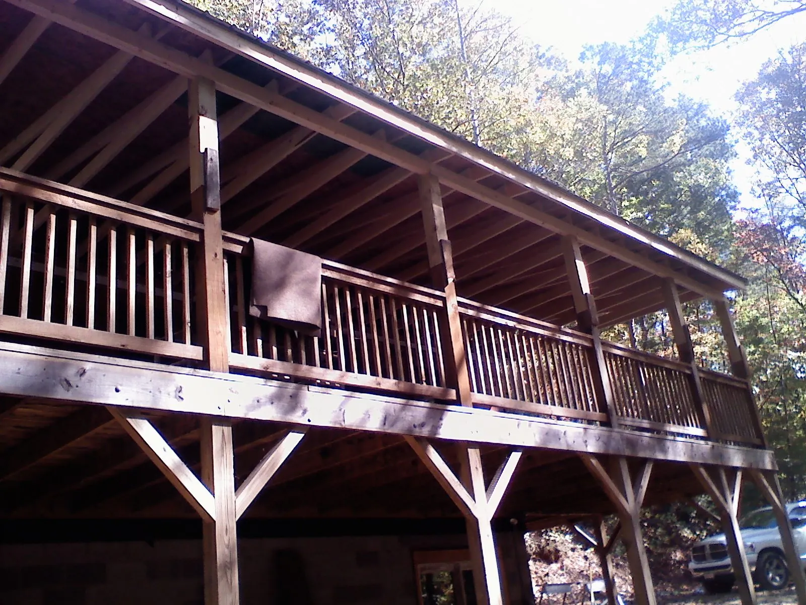 Timber framing under a new elevated porch and deck — Roof Leak Repair in Barnardsville by Roofing Brothers